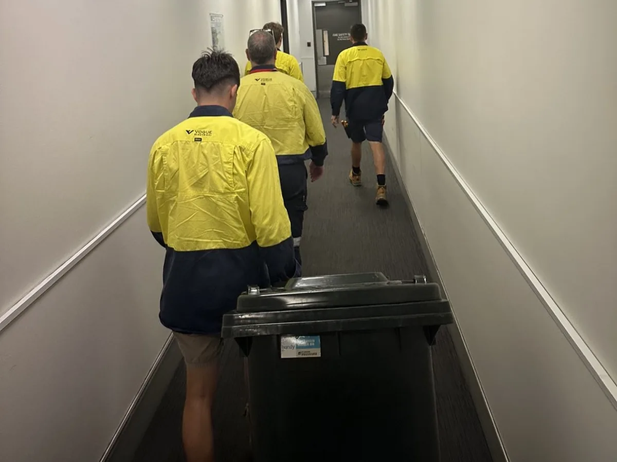 Vogue electricians and technicians in uniform on a commercial site
